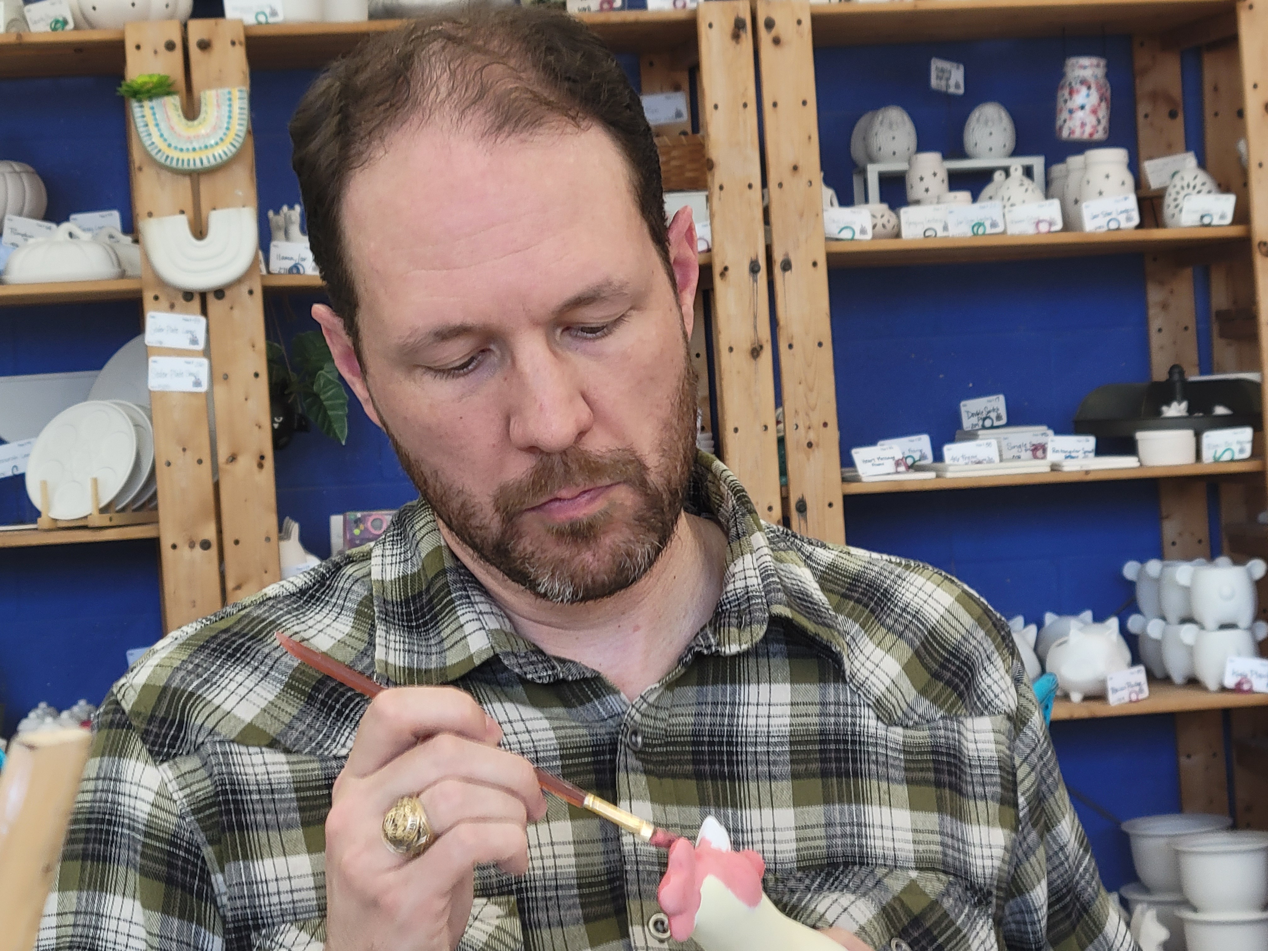 Harvey painting his pottery.jpg