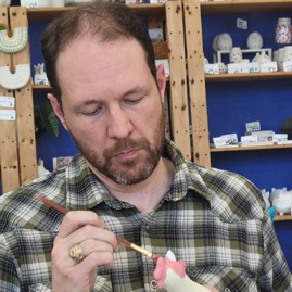 Harvey painting his pottery.jpg